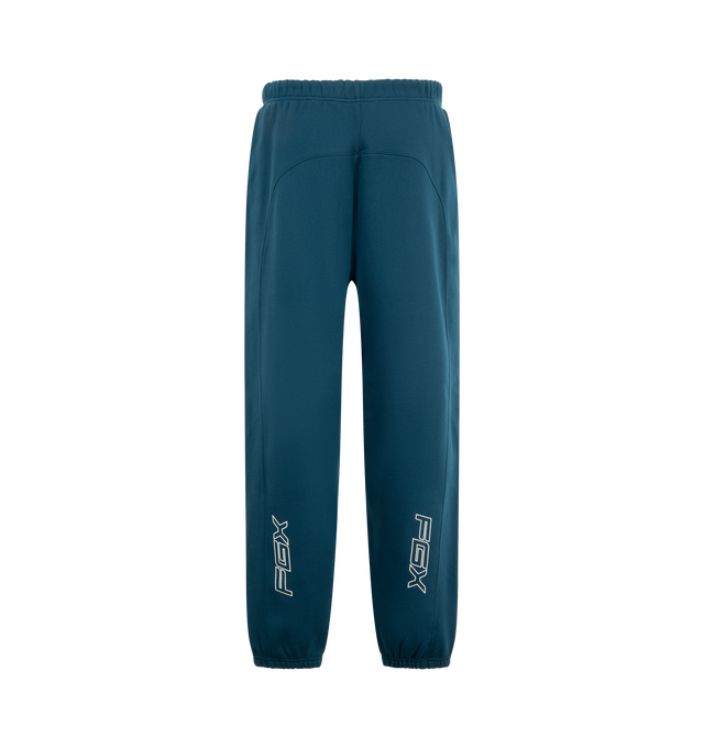 Image 2 of 3 - BLUE - Fear of God ESSENTIALS Classic Moto Sweatpant is crafted from heavyweight 380 GSM cotton-blend fleece and features a relaxed classic-fit silhouette with motocross-inspired seam detailing. Designed with signature 916 puff-print graphics at the front and FGX puff-print graphics extending down the back of the legs, this elevated sweatpant is finished with an encased elastic waistband, internal drawstring, elasticized cuffs, and side-seam pockets for everyday comfort and functionality. Mai