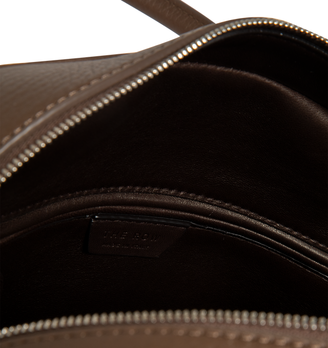Image 3 of 3 - BROWN - THE ROW India 12.00 Bag in Leather featuring updated bowling bag in textured calfskin leather with tubular handles, branded metal padlock and key, and zipper closure. 11.81 x 4.72 x 9.45 in. Handle: 4.33 in. drop. 100% calfskin leather. Made in Italy.