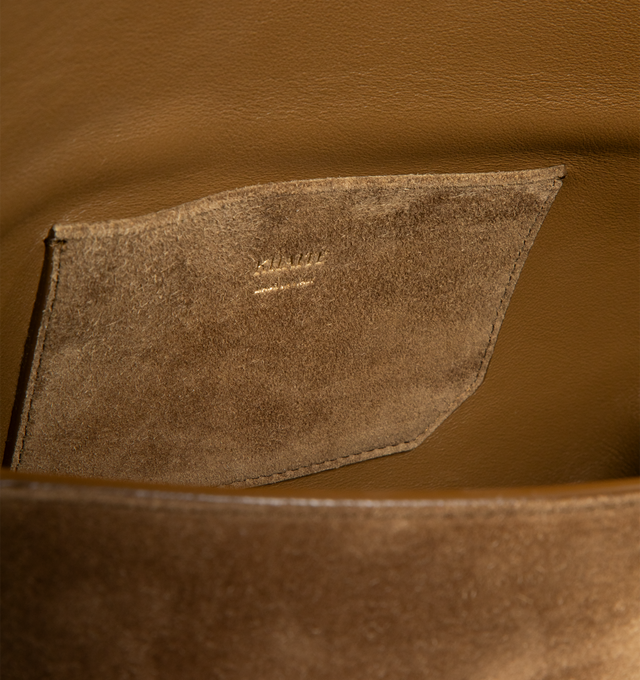Image 3 of 3 - BROWN - KHAITE Audrey Crossbody Bag featuring a flap-front bag to carry across the body, on the shoulder, or as a clutch with removable, adjustable strap and magnetic clasp closure. 8.6 in x 1.6 in x 5.5 in. Handle Drop: 15.7 in. 100% calfskin. Made in Italy.