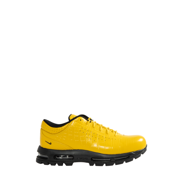 Image 1 of 5 - YELLOW - Nike Air Max Goadome Low Croc Sneakers are crafted from premium leather upper, a padded collar, perforated accents, debossed branding at the tongue, and an embossed Swoosh at the ankle. Finished with visible Nike Air cushioning and a lugged rubber outsole for enhanced traction, the Air Max Goadome Low blends trail-ready durability with everyday wearability. Main Material: Leather Upper. Cushioning: Nike Air with Visible Air Unit. Outsole: Lugged Rubber.