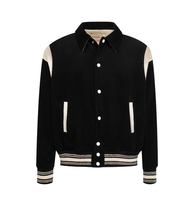 Image 1 of 3 - BLACK - SAINT Mxxxxxx Men's Corduroy Varsity Jacket is crafted from cotton corduroy and features a classic varsity-inspired silhouette with a pointed collar, snap-button front closure, and contrast shoulder panels. Designed with welt pockets, striped rib-knit cuffs and hem, and vintage collegiate influences, this statement jacket blends heritage sportswear styling with SAINT Mxxxxxx's contemporary streetwear aesthetic. Main Material: Cotton Corduroy. Made in Japan.