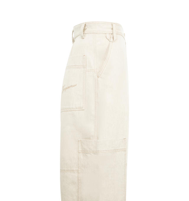 Image 3 of 3 - WHITE - JACQUEMUS Carr de-Nmes Denim Cargo Pants featuring high-rise, soft cotton-hemp denim, belt loops, engraved metal button fly, slant pockets, wide straight legs, reinforcement stitching around the knee, side patch pockets, embroidered patch on the back, back patch pockets with laser-printed logo and contrast topstitching. 80% cotton, 20% hemp. Lining: 65% polyester, 35% cotton. Made in Portugal.