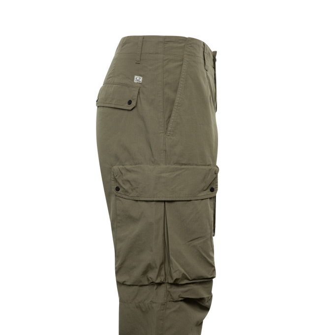 Image 3 of 3 - GREEN - C.P. COMPANY Rip-Stop Loose Utility Cargo Pants featuring zip fly and button fastening, reinforced belt loops, slanted hand pockets, single buttoned back pocket, multiple secure leg pockets, lens detail, adjustable leg openings, garment dyed and loose fit. 100% cotton. 