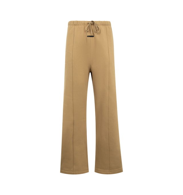 Image 1 of 3 - BROWN - FEAR OF GOD ESSENTIALS Signature Lounge Sweatpant featuring heavy 480GSM core fleece, oversized silhouette, Essentials signature logo embroidered on the leg, front leg seam, encased elastic waistband with elongated drawcords, side-seam pockets and an Essentials signature label at the center front. 80% cotton, 20% polyester.