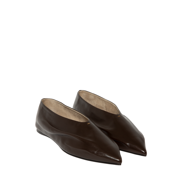 Image 2 of 4 - BROWN - Khaite Miriam ballerina flat inspired by the soft folds of fabric and crafted in Italy of glazed calfskin selected for its luminous shine. The deconstructed body is lined in cigar-hued suede, accentuating a natural fit that moves with the foot. Detailed with signature gold staple. Made in Italy. Glazed calf (100% calfskin).