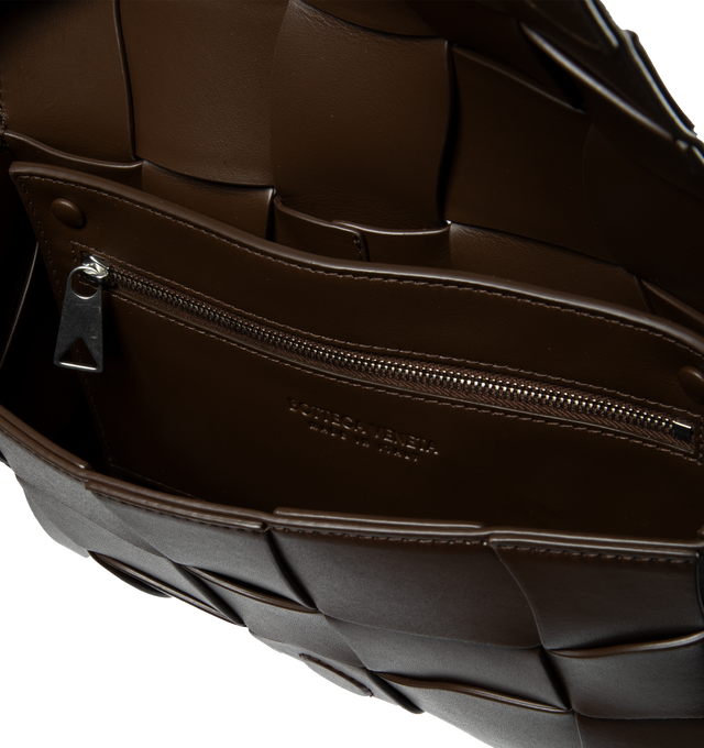 Image 3 of 3 - BROWN - BOTTEGA VENETA WAVED LEATHER CASSETTE CROSSBODY BAG with adjustable crossbody strap, magnetic fastening front flap closure, all-over intrecciato weave and one main compartment. 100% Leather. 