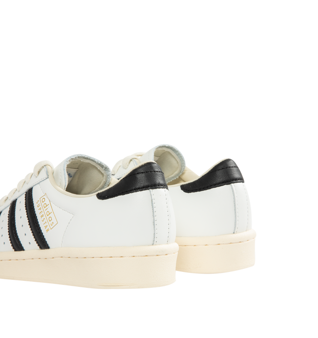 Image 3 of 5 - WHITE - ADIDAS Superstar Vintage Sneaker featuring shell toe, 3-Stripes and heel tab, a leather upper, lining and insole all sits atop a classic rubber cupsole, regular fit, lace closure and rubber outsole.