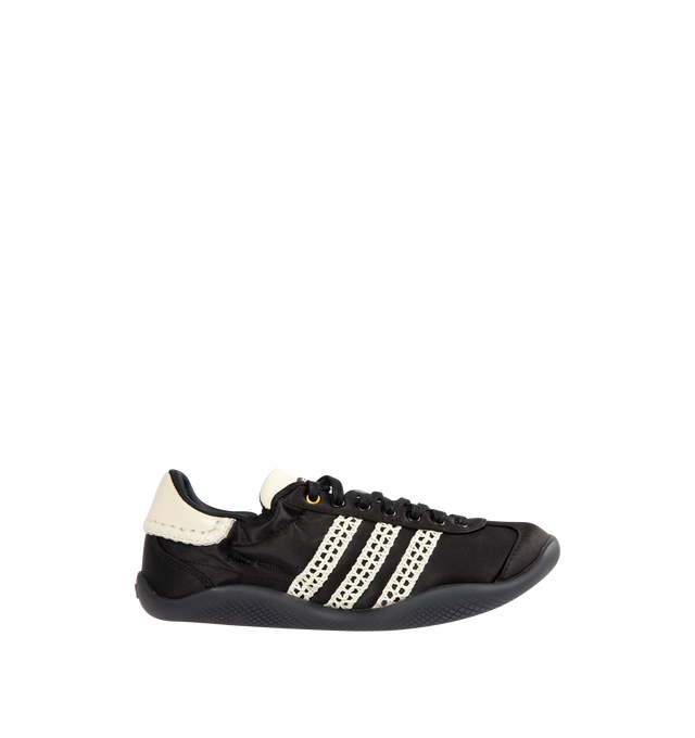 Image 1 of 5 - BLACK - ADIDAS X WALES BONNER Karintha Lo Satin Sneaker featuring contrast corded stripe at sides, elastic top, removable insole, lace-up closure, round toe and rubber sole.