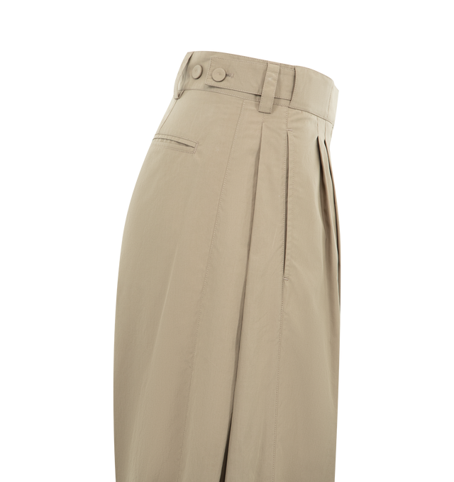 Image 3 of 3 - BROWN - THE ROW Iven Pant featuring tailored low-rise pant in softly crinkled technical silk with barrel leg, front double pleats, adjustable back button tabs, and side welt pockets. 65% silk, 35% nylon. Made in Italy.