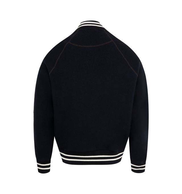 Image 2 of 2 - NAVY - WALES BONNER October Varsity Jacket featuring collegiate silhouette in boiled wool with contrast ribs, silk piping, relaxed Fit, brown topstitch and a chenille logo patch. 100% wool. Made in Portugal.