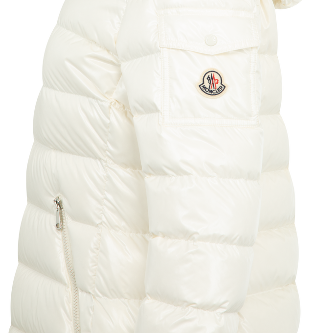Image 4 of 4 - WHITE - MONCLER Badyf Faux Fur-Trimmed Hooded Short Down Jacket featuring nylon laqu lining, down-filled, detachable faux fur trim, detachable and adjustable hood, zipper closure, flap sleeve pocket, zipped pockets and adjustable cuffs. 100% polyamide/nylon. Padding: 90% down, 10% feather.