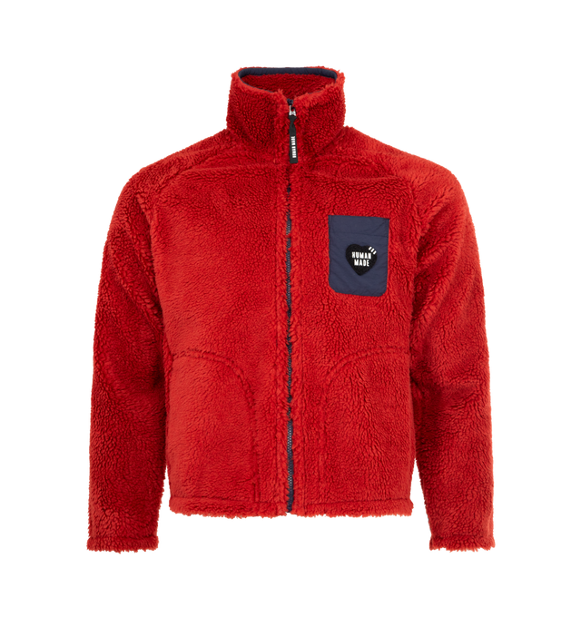 Image 1 of 3 - RED - HUMAN MADE Fleece Jacket featuring soft polyester boa fabric, heart-shaped magic tape on the left chest pocket, removing the tape reveals a text graphic, contrasting piping and pockets, chain-stitched animal graphic on the back, heart-shaped snap buttons on the cuffs and mesh lining with wind-proof film. 100% polyester. Contrast: 100% nylon.