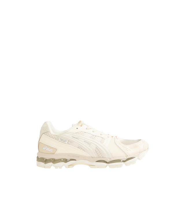 Image 1 of 5 - CREAM - ASICS x INVINCIBLE x Madness GEL-KAYANO 12.1 Sneakers feature a mesh upper with synthetic and leather overlays, combining technical performance heritage with elevated collaborative design. Created in partnership with INVINCIBLE and Madness, this updated GEL-KAYANO 12.1 silhouette is detailed with co-branded patches on the padded tongue, signature ASICS Tiger Stripes at the side panels, and tonal lace-up fastening. Finished with an EVA and FluidRide midsole for lightweight cushioning a