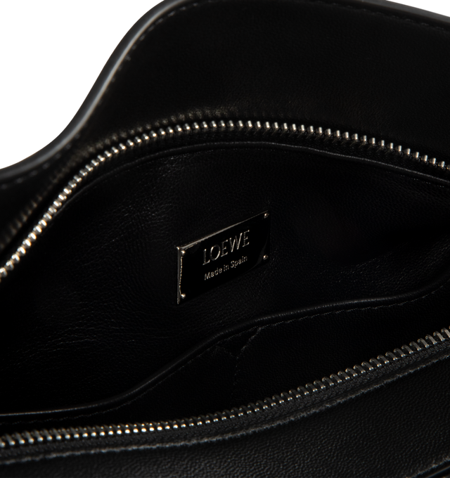 Image 4 of 4 - BLACK - LOEWE PAULA'S IBIZA Medium Puzzle Featherlight bag in nappa lambskin featuring distinctive geometric lines and cuboid form, supple featherlight nappa that makes the bag soft and slouchy, a shoulder handle, detachable and adjustable strap with rotating dogclips, zip closure with articulated pull, detachable LOEWE gold or silver embossed tag with secret pocket and balloon dice, baguette-shaped metal feed, nappa lambskin lining and embossed Anagram, LOEWE engraved internal plaque. Feathe