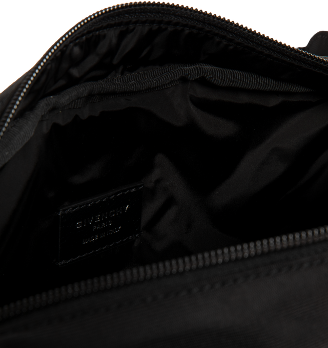 Image 4 of 4 - BLACK - GIVENCHY Essential U Belt Bag in nylon featuring handle on the top, zipper closure with leather zipper pull, adjustable GIVENCHY webbing strap for a crossbody carry, metal GIVENCHY signature on the front, silvery-finish metal details, one main zipped compartment and two zipped pockets on the front. 10.6 in x 5.9 in x 3.1 in. 100% polyamide. Made in Italy.