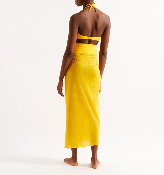 Image 3 of 4 - YELLOW - ERES Peplum Long Sarong featuring a belt attached in Peau Douce naturelle that can be tied around the waist. Main: 100% Cotton. Second: 77% Polyamid, 23% Spandex. Made in France. 