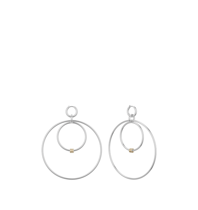 Image 1 of 1 - SILVER - SPINELLI KILCOLLIN Echo SG Hoops featuring a bold silhouette with lightweight, versatile components handcrafted from .925 sterling silver and 18k yellow gold. The inner hoop at this style's center supports tactile annulets and is fused to a jump ring, anchoring the large outer hoop that echoes its partner. Micro Hoop: .925 sterling silver. Echo Hoops: .925 sterling silver. 1.7mm gauge. 57mm internal diameter. Jump Ring: .925 sterling silver. Annulets: 18k yellow gold.