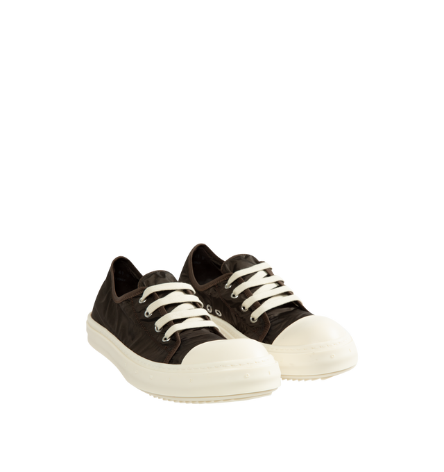 Image 2 of 5 - BROWN - Rick Owens Men's Tower Low Sneakers are crafted from a nylon and polyester blend and feature an extra-low silhouette that rises at the back, four-eyelet lace-up closure, six side vents, toe caps, and signature shark-tooth bumper soles. Main Material: 67% Nylon, 33% Polyester. Toe: 100% Calf Leather. Lining: 67% Nylon, 33% Polyester. Insole: 100% Calf Leather. Sole: 100% Thermoplastic Rubber. Closure: Lace-Up. Made in Italy.
