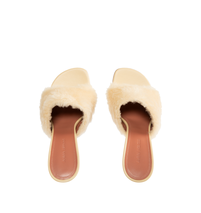 Image 4 of 4 - NEUTRAL - AMINA MUADDI Taylor Fur Slippers 90 featuring 90mm slanted heel, rounded open toe, beige fur strap and slip on style. Upper: 100% lamb leather. Lining: 100% goatskin. Sole: 90% calfskin, 10% TPU. Made in Italy.