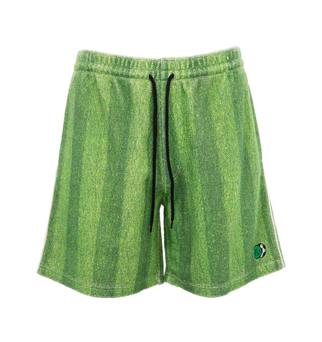 Image 1 of 4 - GREEN - Le Pere Astro sweatshorts recreate the quintessential turf from grass football pitches printed on the inside of an Italian sweatshirt cotton fabric. Features an embroidered patch on the bottom left leg as well as a pocket in the back. 100% Cotton. Made in Portugal.  