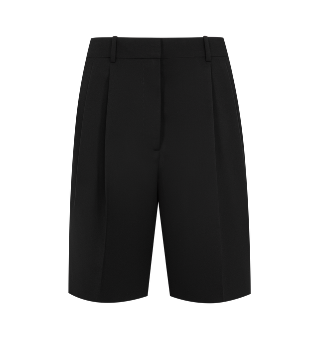 Image 1 of 3 - BLACK - KHAITE Auggie Short featuring a trouser-inspired knee-length short tailored with fluid precision in lightweight wool suiting, paired reverse pleats, belt loops, side pockets and back welt pockets. 100% virgin wool.