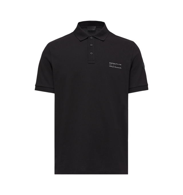 Image 1 of 1 - BLACK - MONCLER Polo featuring short sleeves, three-button placket, chest pocket, ribbed collar and straight hem. 100% cotton.