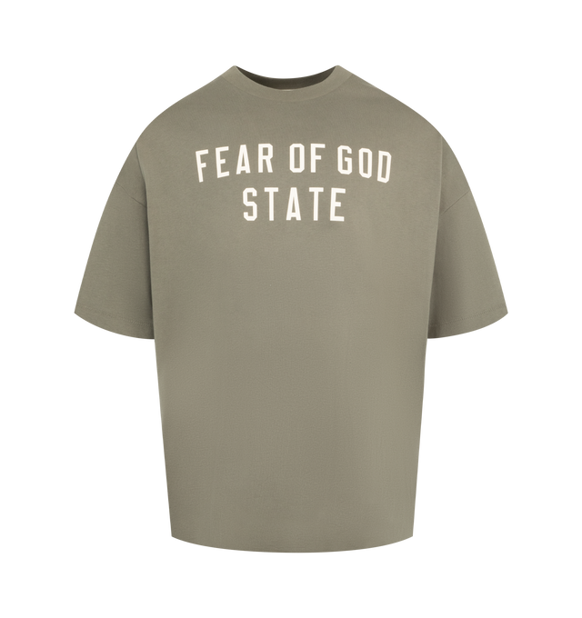 Image 1 of 2 - GREEN - FEAR OF GOD ESSENTIALS 90's Fit Tee featuring rib-knit crewneck, short sleeves, logo printed at chest, dropped shoulders and rubber logo patch at back collar 100% cotton.