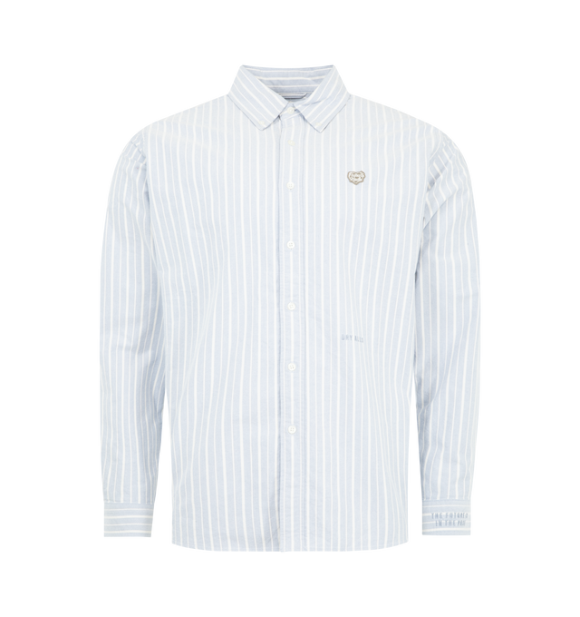 Image 1 of 2 - BLUE - HUMAN MADE Striped Oxford Button Down Shirt featuring soft Oxford fabric, all-over striped pattern, button-down collar, front button closure, signature heart patch on the chest, tonal text embroidery on the left front and sleeve, buttoned cuffs and curved hem. 100% cotton.