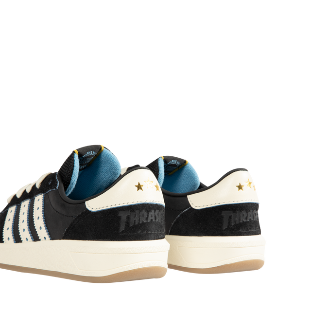 Image 3 of 5 - BLACK - Adidas Mens Glenburn x Thrasher Sneaker is crafted from suede and leather with a rubber sole. Features a lace-up closure, padded tongue with logo patch detail, padded low-cut collar, signature stripes with perforated trim, almond toe, and includes spare laces. Suede and leather upper with rubber sole. Made in Vietnam.