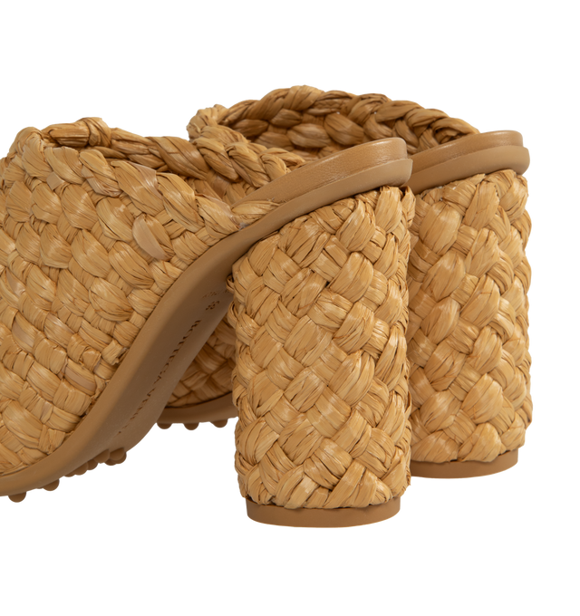 Image 3 of 4 - BROWN - BOTTEGA VENETA Atomic Intrecciato Raffia Sandals featuring woven raffia into a towering silhouette set atop a thick cylindrical heel, rubber-gripped soles and slips on. 4" heel. Raffia. Made in Italy. 