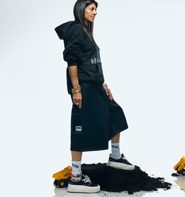 Image 9 of 9 - BLACK - NAHMIAS Ollie Sneaker featuring round rubber cap toe, lace up closure, textile logo patch at tongue, branded logo detail on outsole lip, padded tongue and collar, treaded logo outsole, rubber midsole, logo emboss on heel and logo gum bottom.