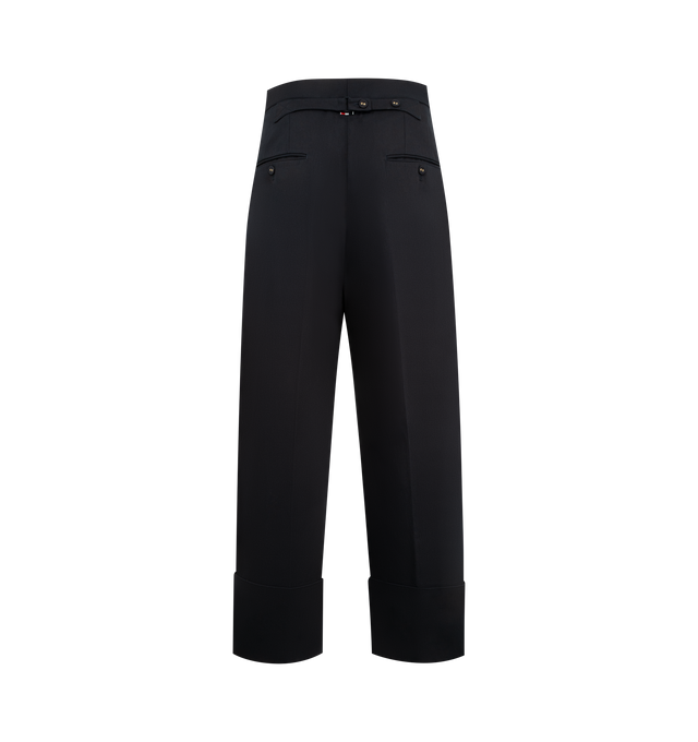 Image 2 of 3 - NAVY - THOM BROWNE Backstrap Double Pleat Trouser featuring high rise, tab front closure, slip side pockets, back welt pockets, front pleats, wide cuffs and adjustable buttoned backstrap. Made in Italy.