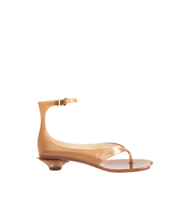 Image 1 of 4 - BROWN - CHLOE Jelly Sandal featuring transparent TPU, thong front with a distinctive wavy sole, shell-shaped heel, adjustable, buckled ankle strap and an oversized tonal Chlo logo on the sole. Sandal heel height: 1". Upper: TPU. Heel: polycarbonate.