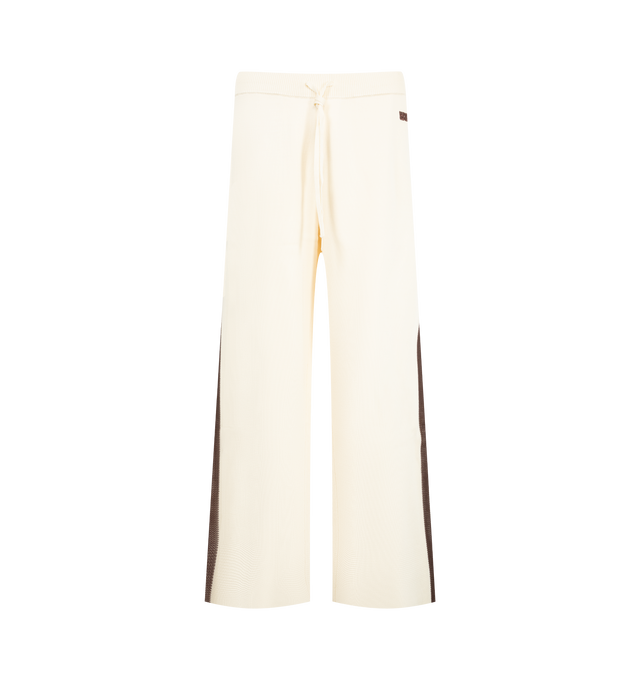 Image 1 of 3 - NEUTRAL - Wales Bonner Men's Tide Trackpant is crafted from a viscose-poly knit and features the brand's signature track pant silhouette in an ivory colorway. Detailed with crochet stripe accents along the sides of the legs, this elevated sportswear style combines a relaxed fit with refined texture and craftsmanship. 80% Viscose, 20% Polyester.