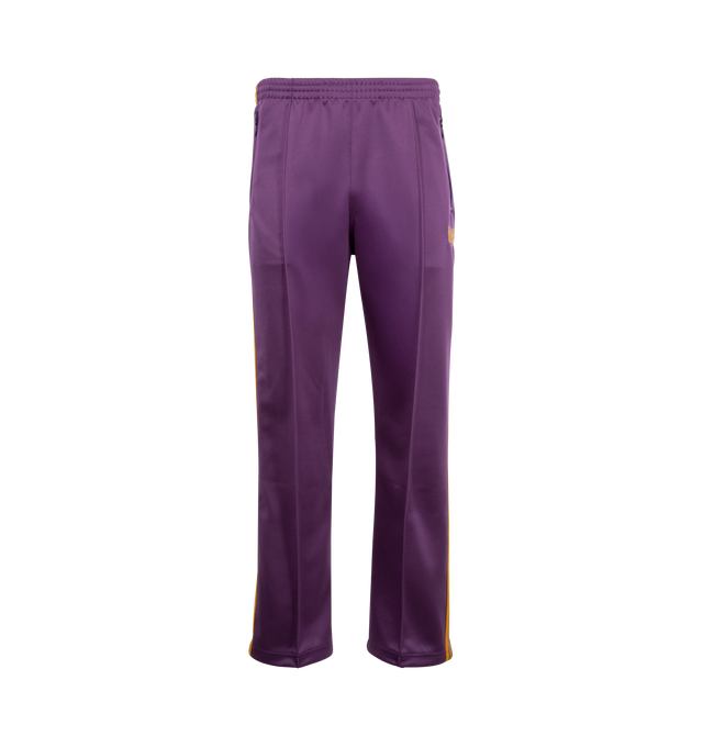 Image 1 of 3 - PURPLE - NEEDLES Track Pants featuring polyester interlock jersey, concealed drawstring at elasticized waistband, three-pocket styling, pinched seams and embroidered logo graphic at front and striped knit trim at outseams. 100% polyester. Made in Japan.