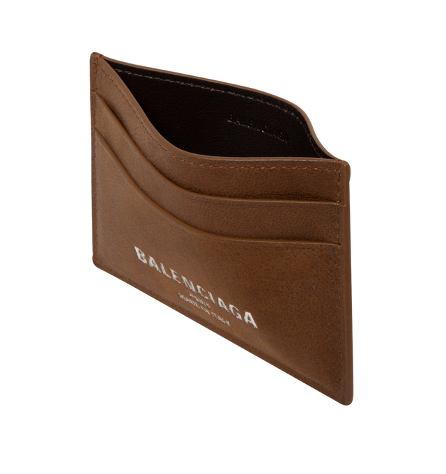 Image 3 of 3 - BROWN - Balenciaga Card Holder is crafted from smooth calfskin leather. Features four card slots, one bill pocket, and debossed Balenciaga Paris logo with silver foil at the front. Main Material: 100% Calf Leather. Made in Italy.