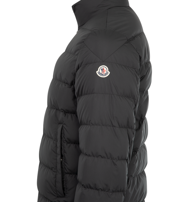 Image 3 of 3 - BLACK - MONCLER Baudinet Short Down Jacket featuring polyester lining, down-filled, zipper closure, pockets with button closure and logo trim. 100% polyester. Padding: 90% down, 10% feather.