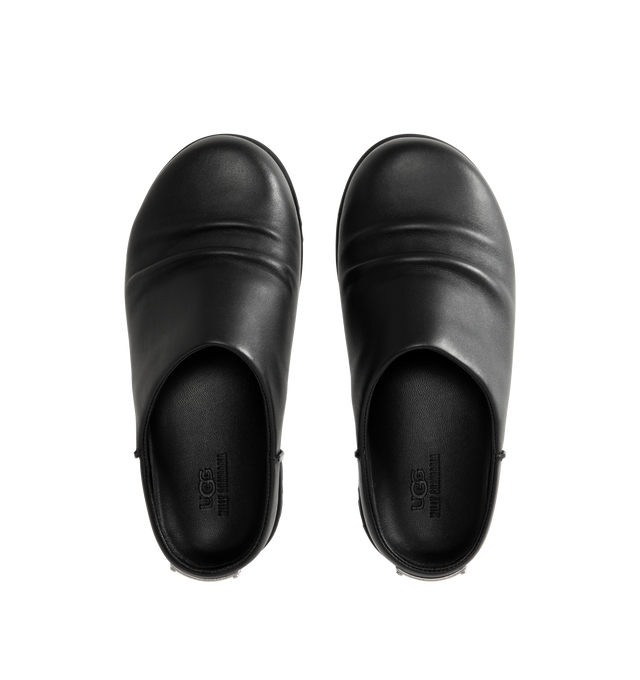 Image 4 of 4 - BLACK - UGG x Willy Chavarria Otzo Clog is crafted from premium black leather and features a slip-on silhouette for effortless everyday wear. Designed with custom Chavarria hardware logo and UGG's signature comfort-focused construction, the clog offers a refined take on casual footwear. Main Material: Leather. Unisex style in men's sizes.