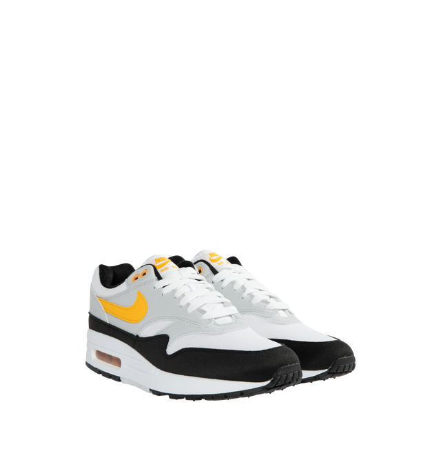 Image 2 of 5 - WHITE - NIKE Air Max 1 featuring premium upper, low-cut collar, full-length Polyurethane (PU) midsole, visible Max Air heel unit and solid rubber waffle outsole. 