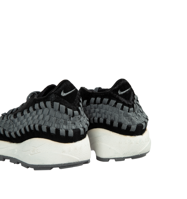 Image 3 of 5 - BLACK - NIKE Air Footscape Sneakers featuring graphic pattern printed throughout, offset lace-up closure, logo embroidered at tongue and heel counter, logo embossed at heel, suede lining, foam rubber midsole and treaded rubber outsole. 