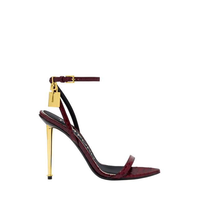 Image 1 of 4 - RED - TOM FORD Semi Shiny Printed Python Padlock Pointy Naked Sandal featuring a pointed toe, signature padlock hardware and a metal spike heel. 105 mm heel. 100% calfskin. Made in Italy.