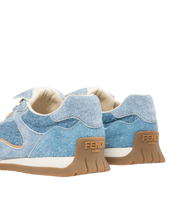 Image 3 of 5 - BLUE - FENDI Wave Pulse Sneaker featuring low-top, lace-up, suede and denim with and tone-on-tone suede-effect printed details, inserts and folded tongue made of the same material, mlange tubular laces, three-dimensional rubber logo on the side, gold-colored metal Fendi logo on the tongue, rubber running sole with wraparound edge on the side and diagonal F motif. 100% calfskin. Inside: 100% lambskin. Made in Italy.