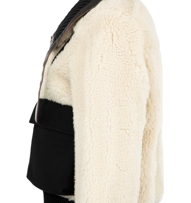 Image 4 of 4 - WHITE - Sacai Women's Wool Faux Shearling Blouson Jacket is crafted in a contrasting black and off-white mixed-fur design with plush sherpa and vegan leather trim. Materials: Wool; Polyester, Cowhide leather, Cupro.