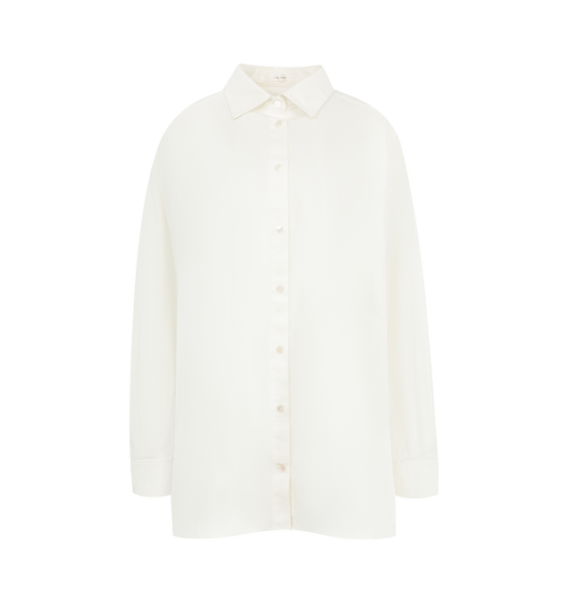 Image 1 of 2 - WHITE - THE ROW Luka Shirt featuring oversized button-down shirt in crisp cotton poplin with menswear-inspired silhouette and curved shirttail hem. 100% cotton. Made in Italy.