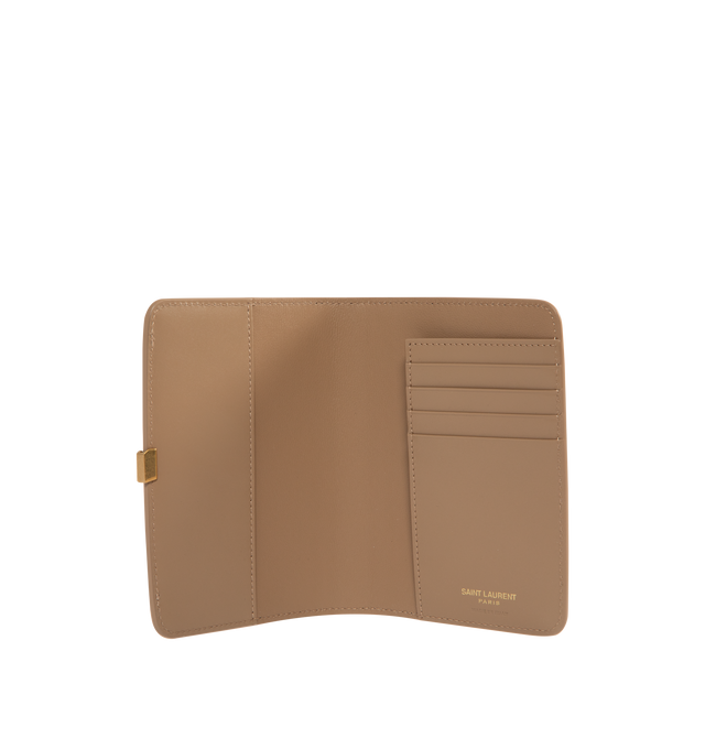 Image 3 of 3 - BROWN - Saint Laurent VOLTAIRE passport holder with inner card slots, decorated with the CASSANDRE. Featuring leather lining, bronze-toned hardware, two flat pockets, five card slots. Measures 5.3" x 3.9" x 0.8". Made in Italy.