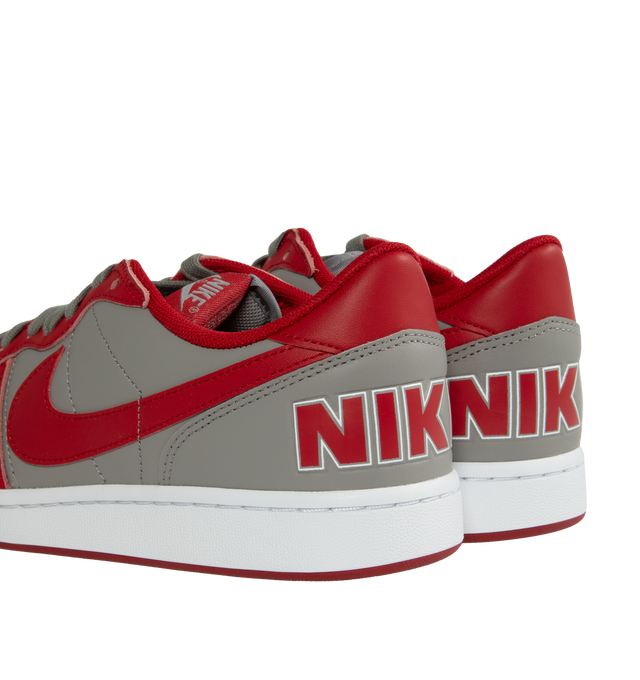 Image 3 of 5 - RED - NIKE Terminator Low UNLV featuring full leather composition, breathability through perforations, mesh tongues and inner lining, grey base, red overlays, Swooshes, tongue labels, liner, insole, and NIKE branding on the heels. 