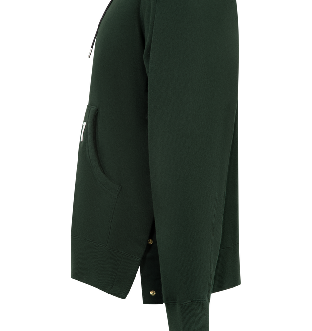 Image 3 of 3 - GREEN - SACAI X CARHARTT WIP Cotton Hoodie featuring a heavyweight cotton jersey fabric with a soft, brushed cotton pile lining, garment-washed for a unique, worn-in appearance, hooded drawstring neckline, kangaroo pocket with co-branded woven label, long sleeves, ribbed cuffs and hem and pullover style. Cotton/polyurethane. Made in Japan.