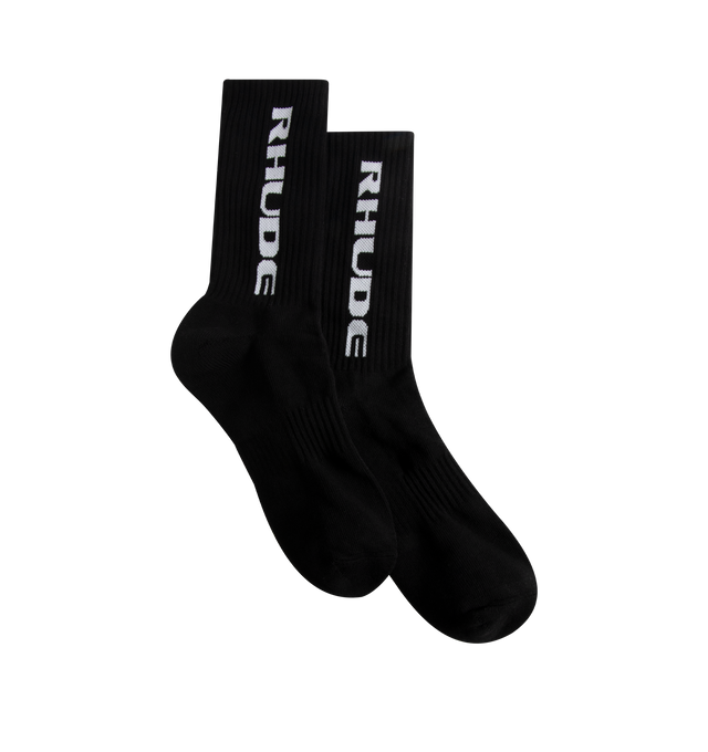 Image 1 of 2 - BLACK - Rhude Mens Sport Socks are crafted from a cotton, polyester, and spandex blend. Feature a ribbed jersey construction and signature vertical Rhude logo. Main Material: 80% Cotton, 12% Polyester, 8% Spandex. Made in China.