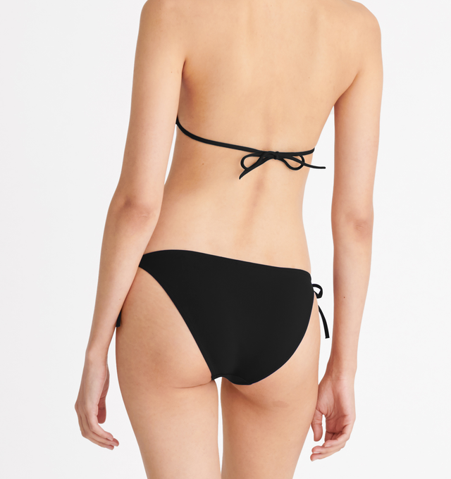 Image 5 of 6 - BLACK - ERES Malou Thin Bikini Brief Bottoms featuring side ties. Main: 84% Polyamid, 16% Spandex. Second: 68% Polyamid, 32% Spandex. Made in France. 