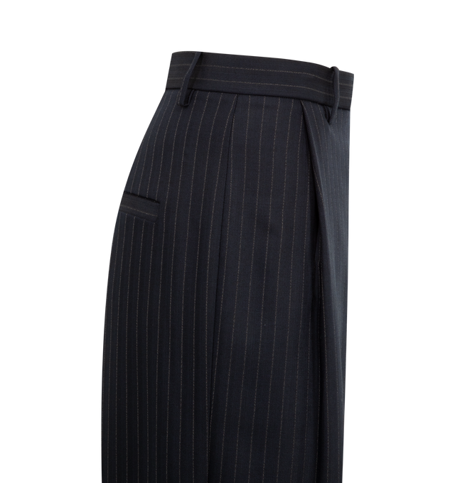 Image 3 of 3 - NAVY - KHAITE Linden Pant featuring a relaxed, wide-leg pant that reflects a deconstructive impulse with raw-edge paneling below the knee and pocket built into front pleat for a smooth fit. 96% virgin wool, 2% elastane, 2% cotton.